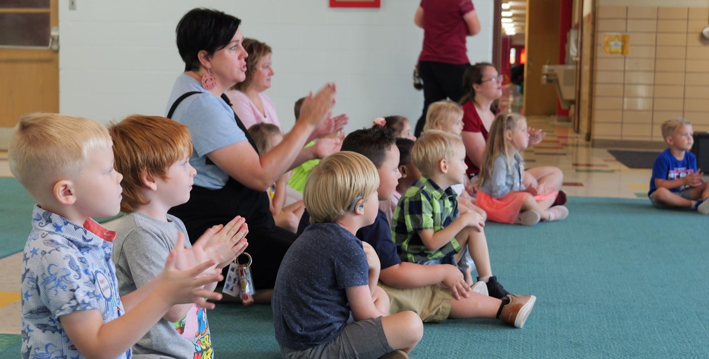 Early Learning Center students look on during a presentation