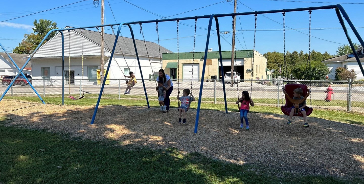 Early Learning Center students on the swingset