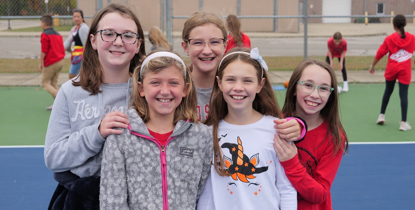 Students pose for a picture on the Big Walnut Intermediate tennis courts