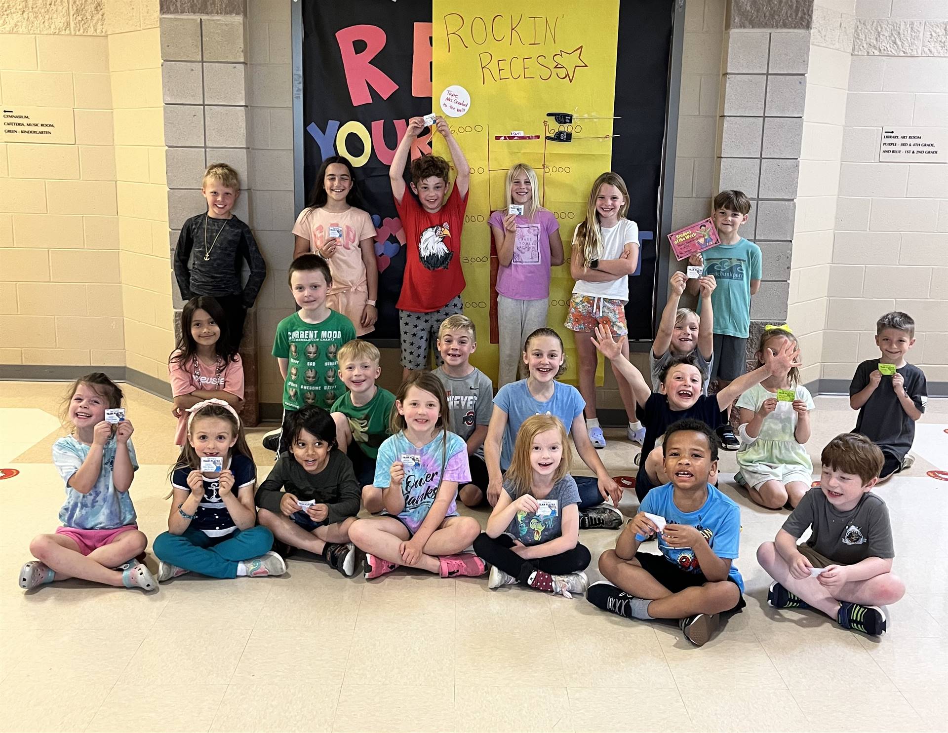 Happy group of kiddos gathered together to show off their awards