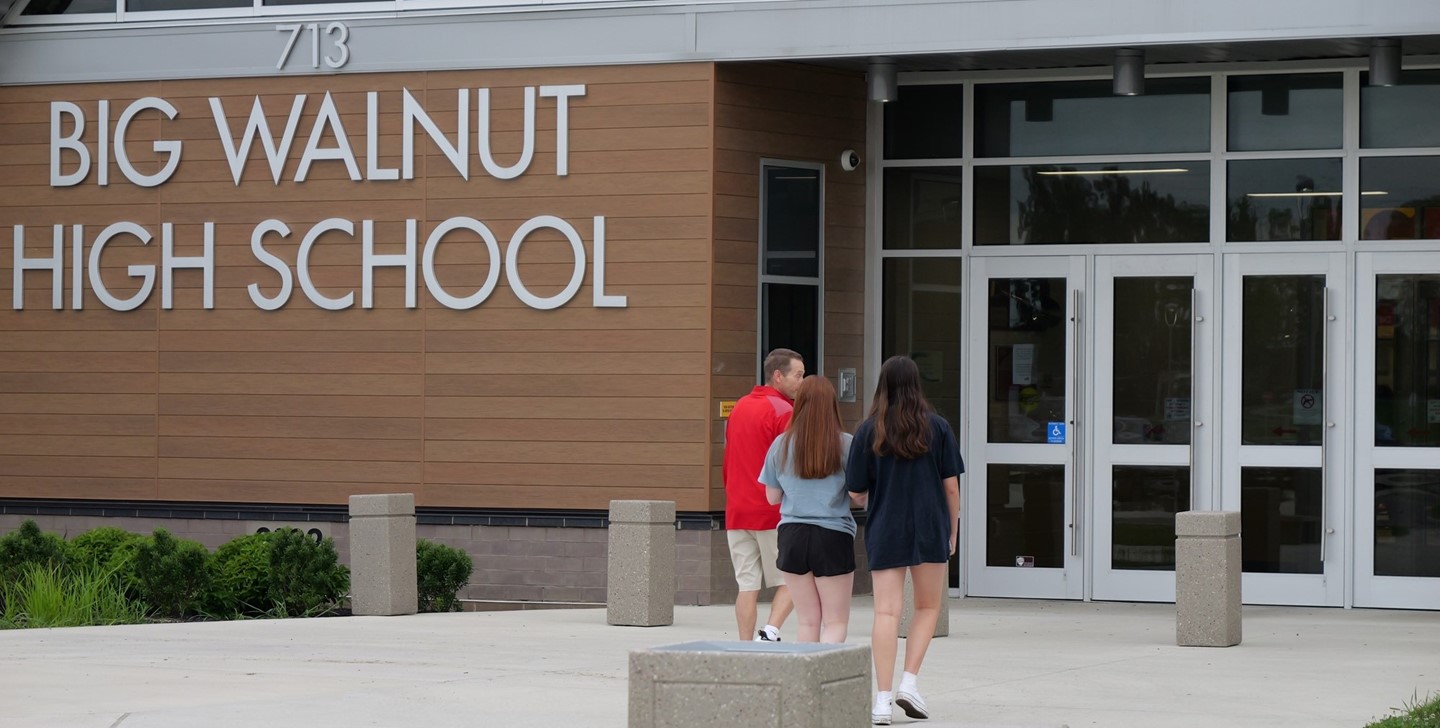 Students walking with a teacher into Big Walnut High School