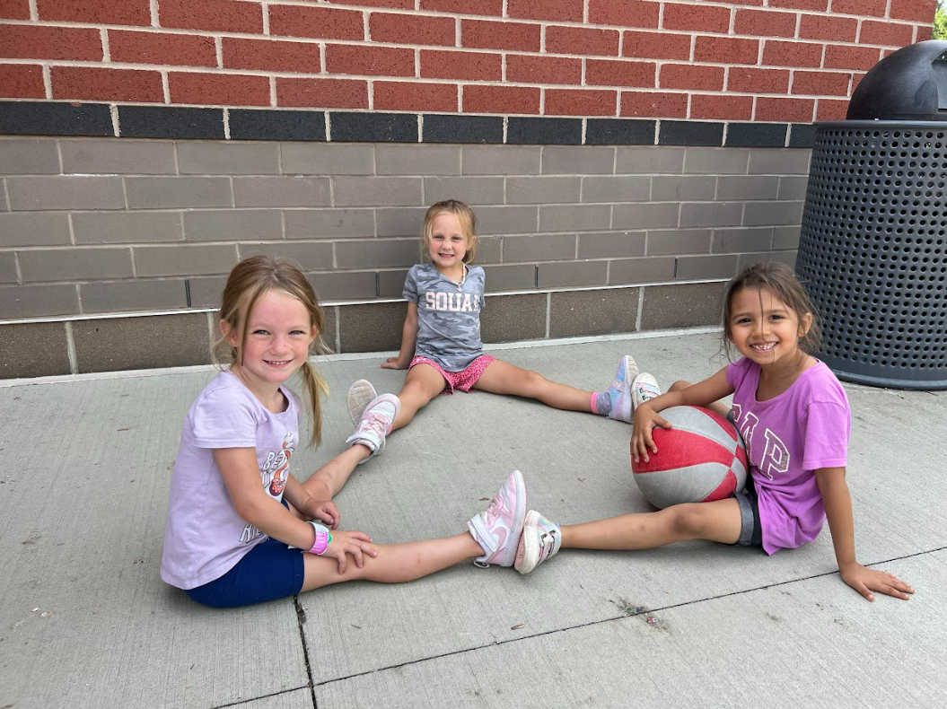 Students pose for a picture at recess
