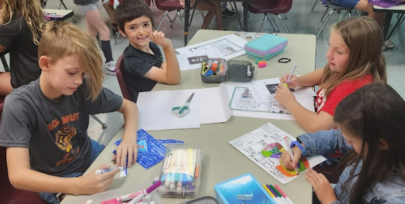 Students coloring in a class at Hylen Souders Elementary