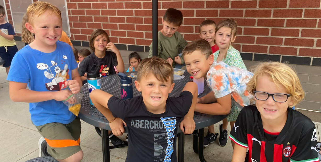 Students at a picnic table outside