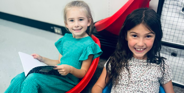 Students reading together in the Hylen Souders Elementary library