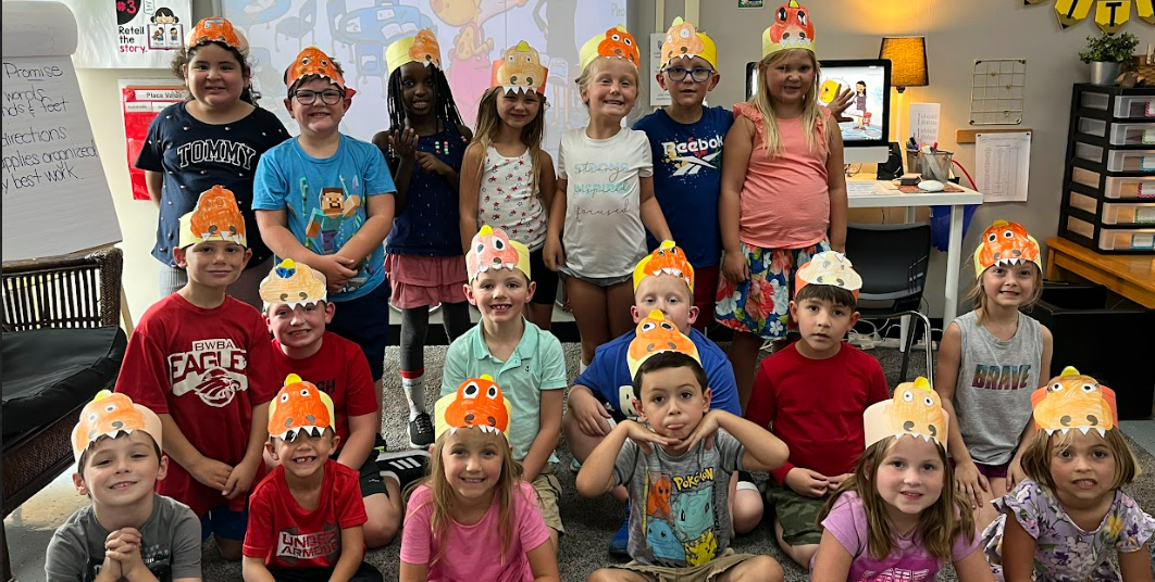 Students showing off their art at Hylen Souders Elementary
