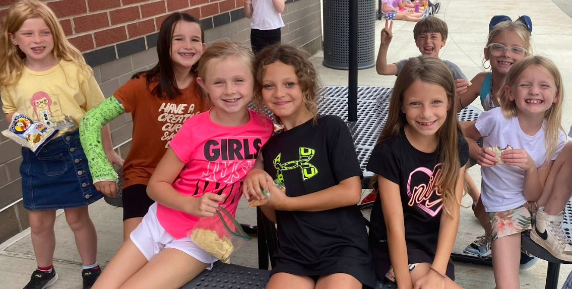Students at a picnic table outside