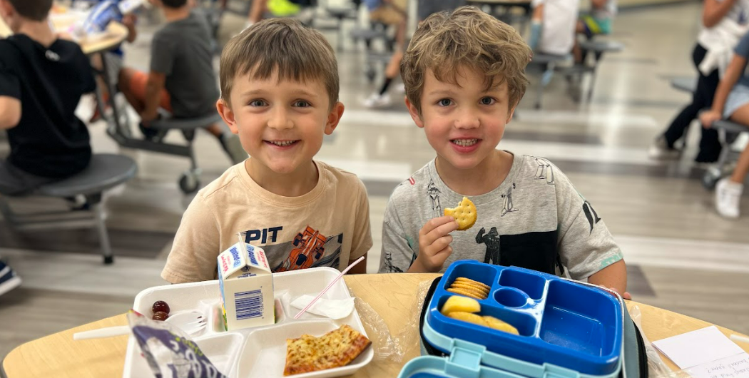 Two students enjoy lunch