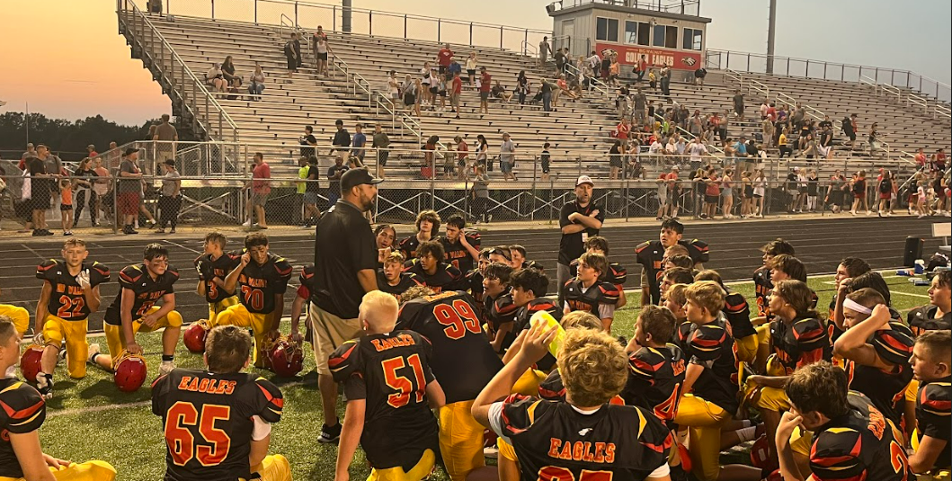 Coach speaks to his team after a football game at Big Walnut Middle School