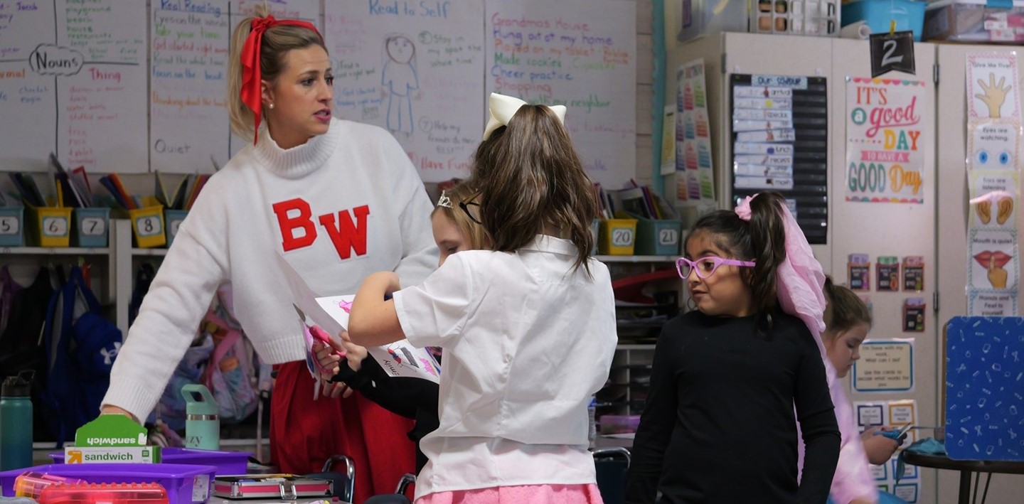 A Big Walnut Elementary teacher and her students on 1950s day