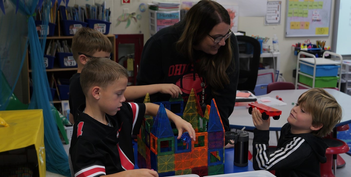 A teacher building a castle with her students at Big Walnut Elementary