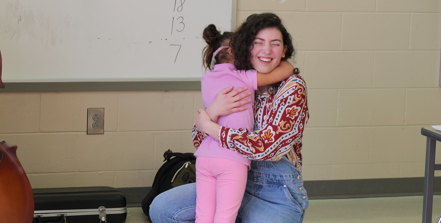 A General Rosecrans student hugs a BWHS student