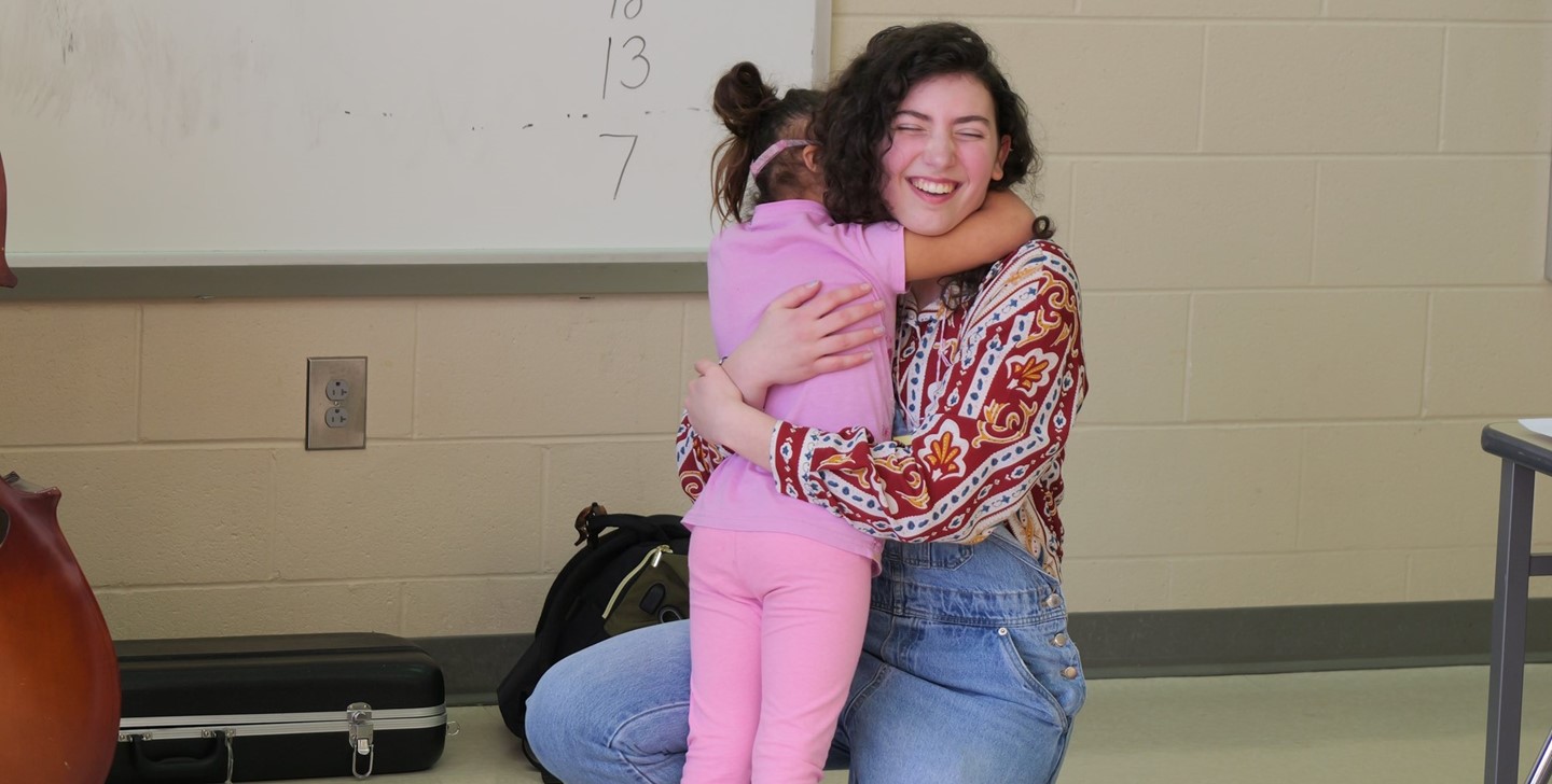 A General Rosecrans student hugs a BWHS student