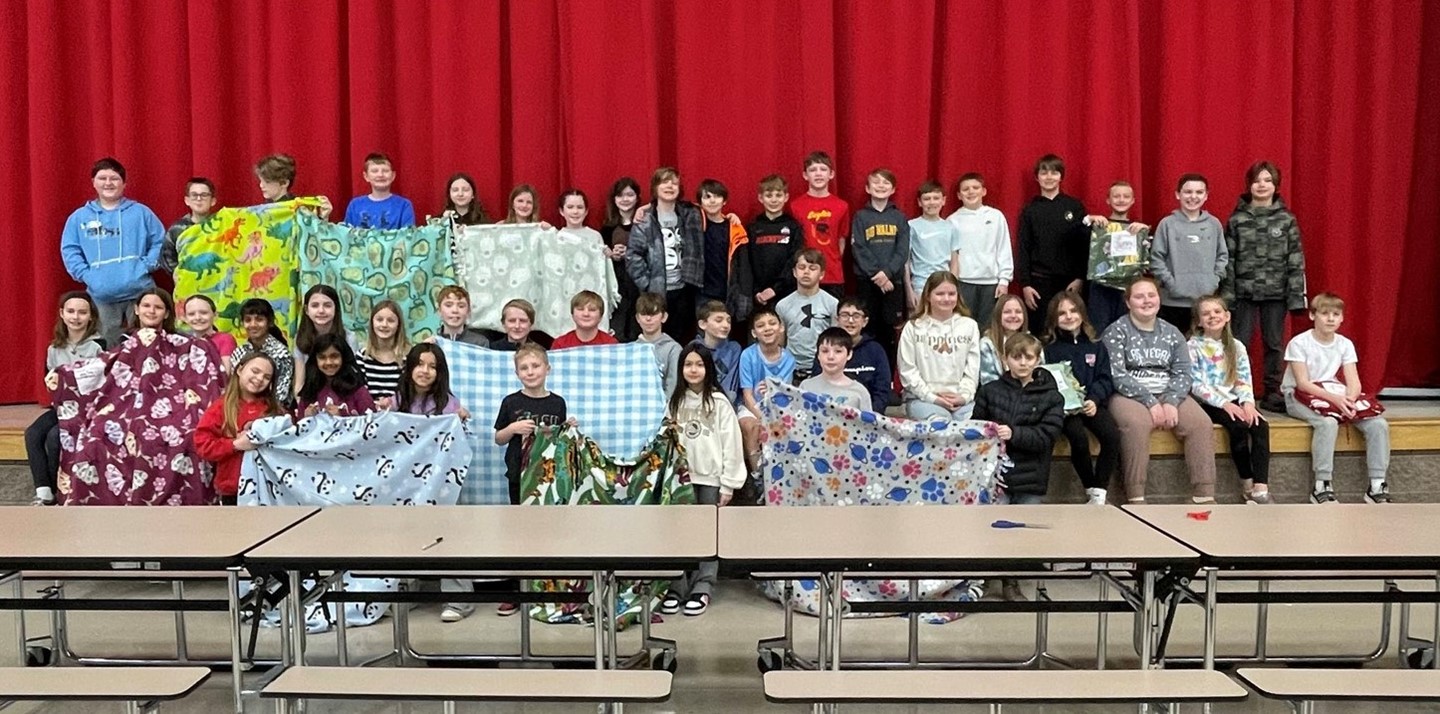Students make blankets as a kindness project