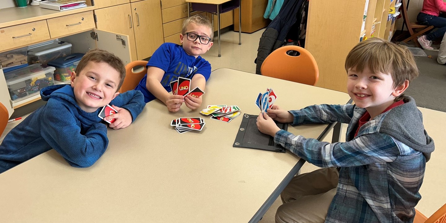 Students play Uno in a classroom