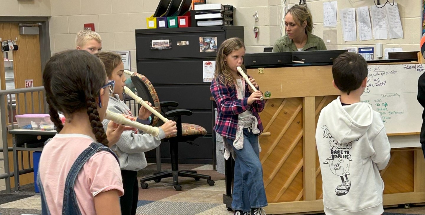 Students playing the recorder in music class