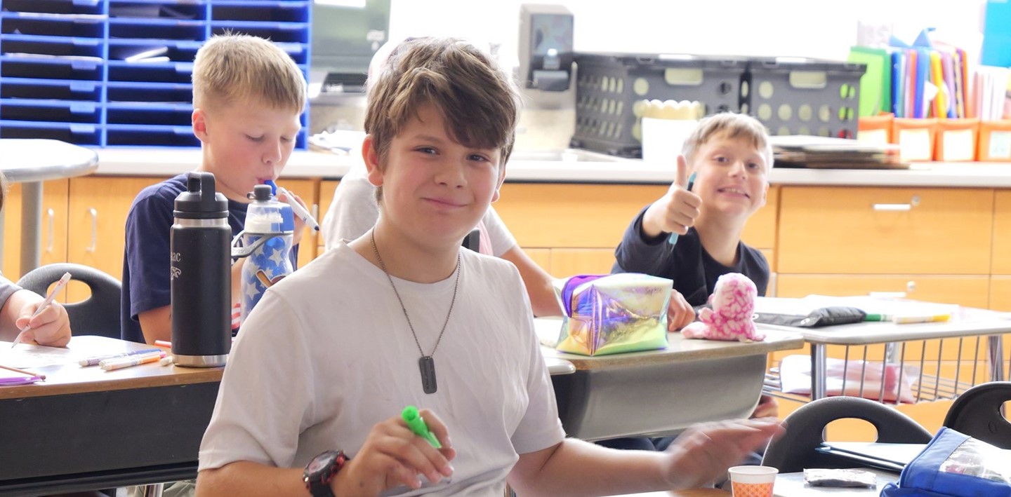A student smiles for a picture