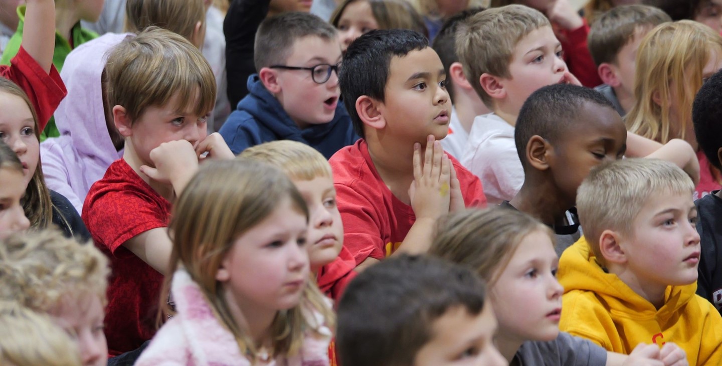 Students listen during an assembly