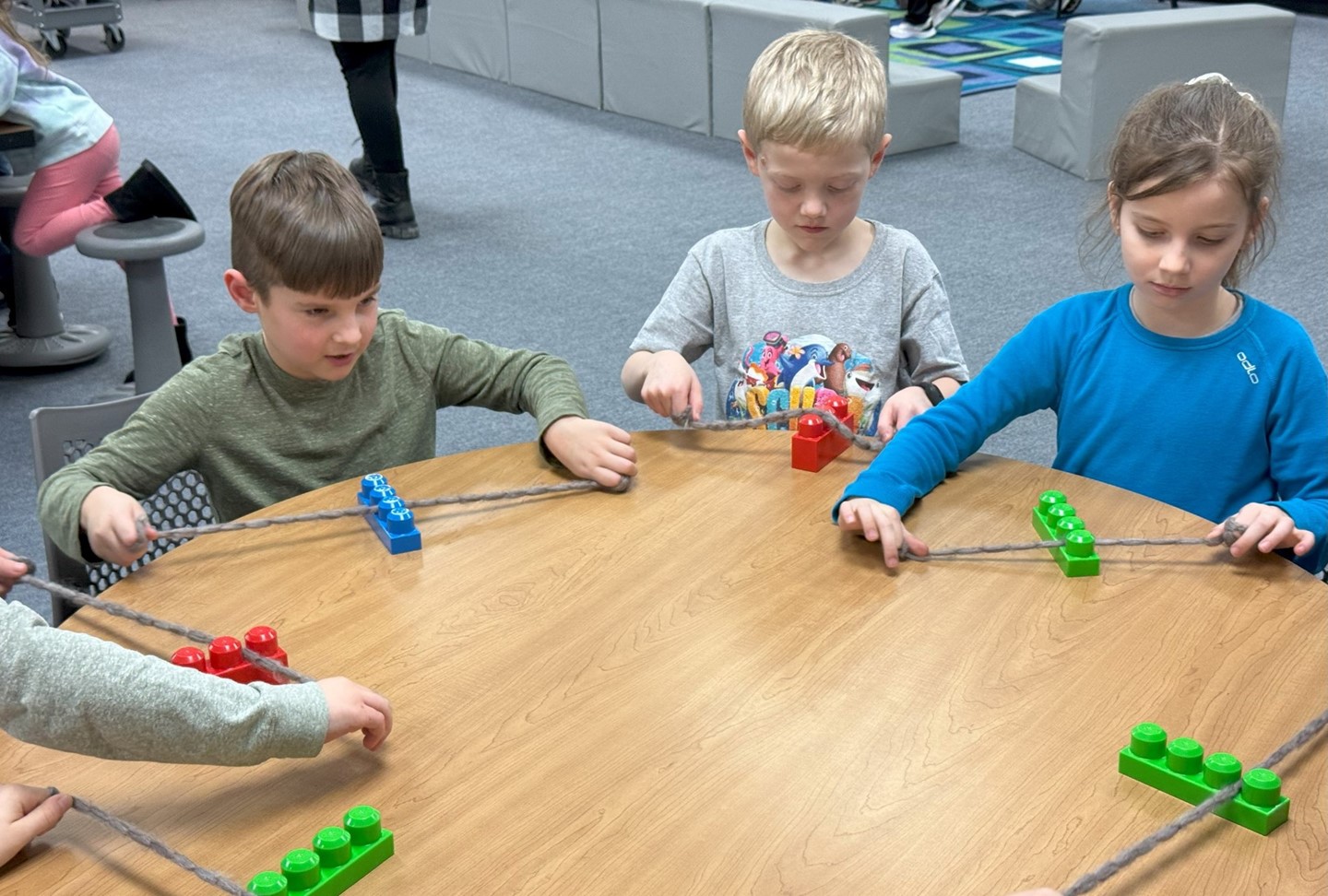 Students floss with legos
