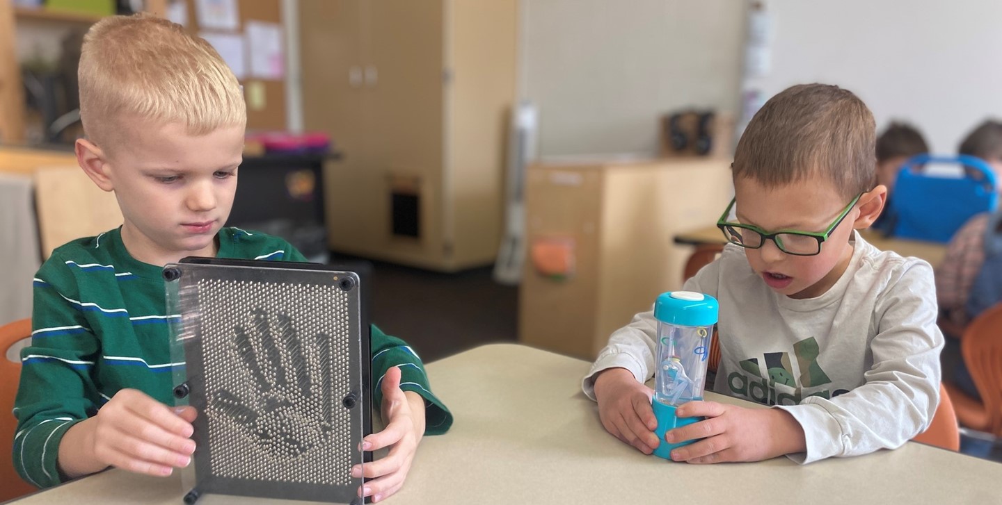 Students play with toys